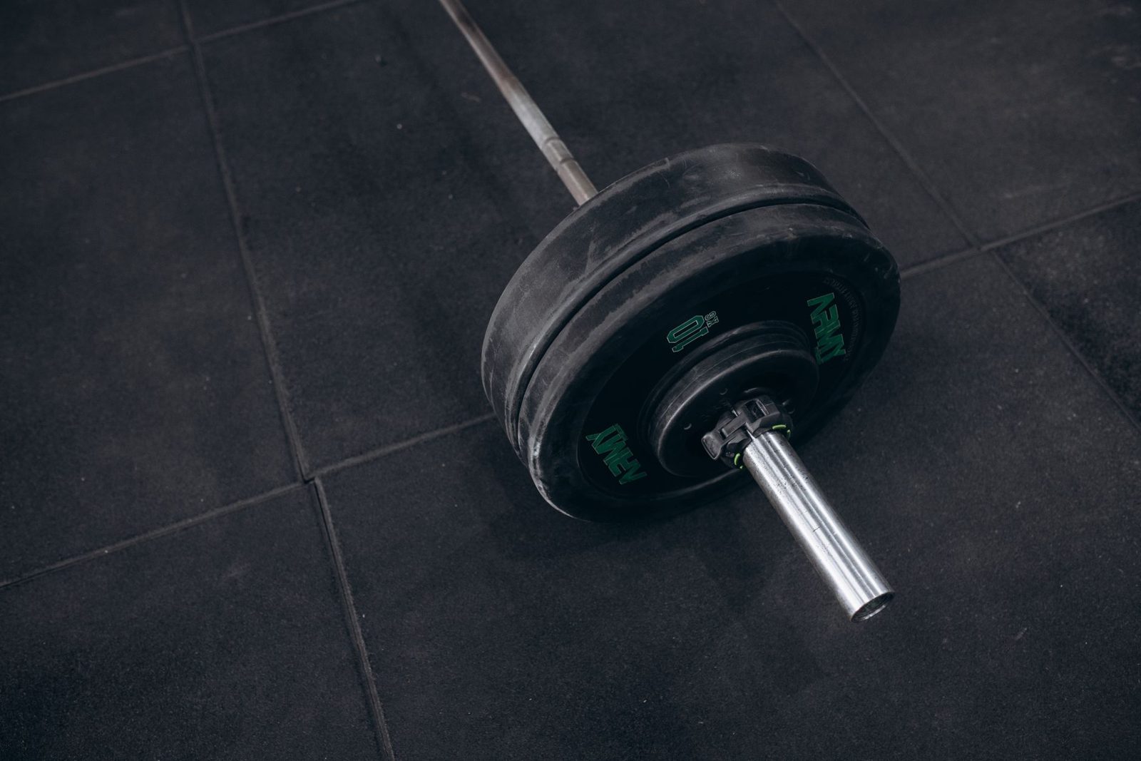 Loaded barbell on a gym floor